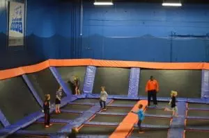 picture of children jumping on trampolines at a trampoline indoor park.