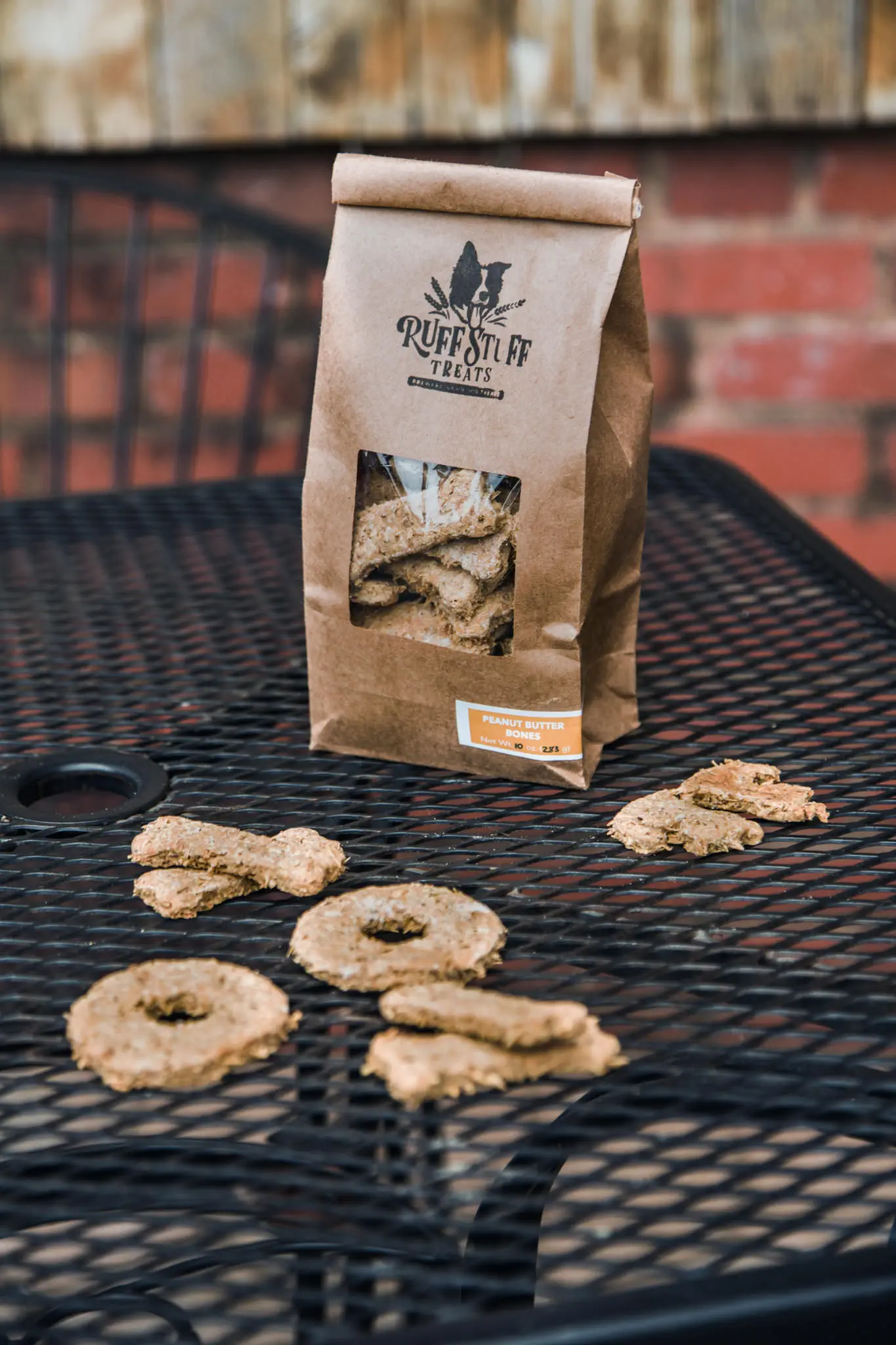 Ruff Stuff Treats bag with dog treats scattered on table